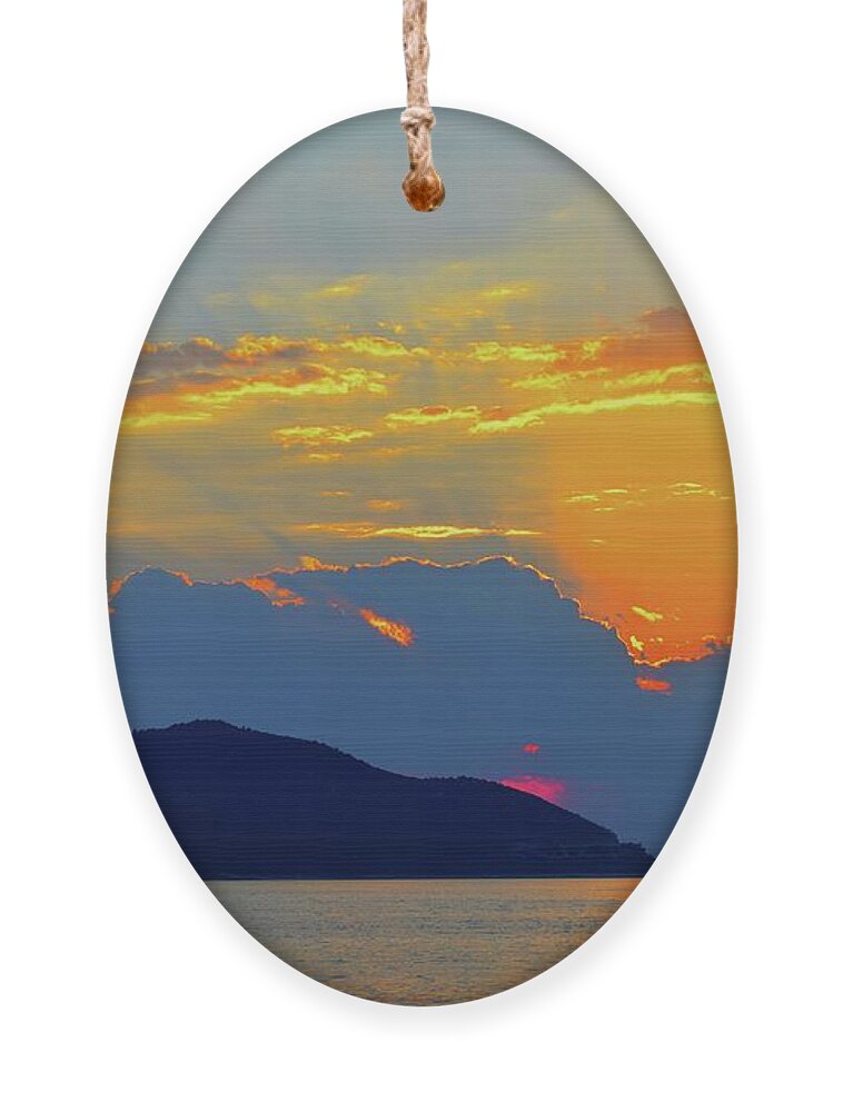 Sunset Magic Above Us Ornament featuring the photograph Sunset Blues by Leonida Arte
