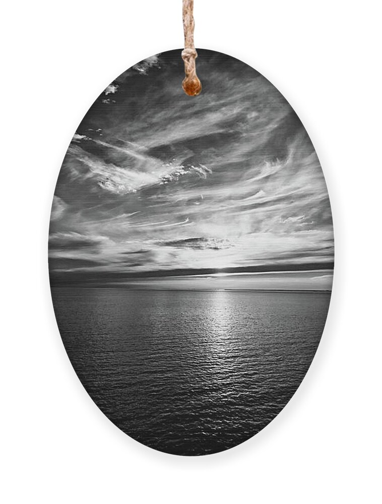 Sunset Ornament featuring the photograph Sunset on the horizon at sea by Bernhard Schaffer