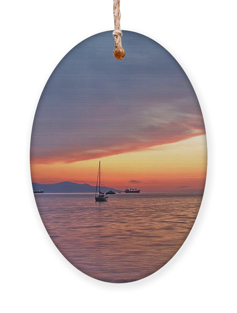Alex Lyubar Ornament featuring the photograph Sunset over the bay in a tranquil summer night by Alex Lyubar
