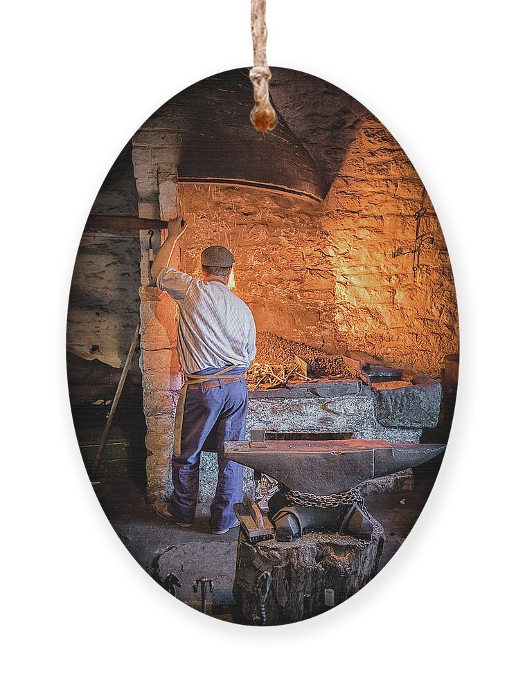 Blacksmith Ornament featuring the photograph The Blacksmith 2 by Nigel R Bell