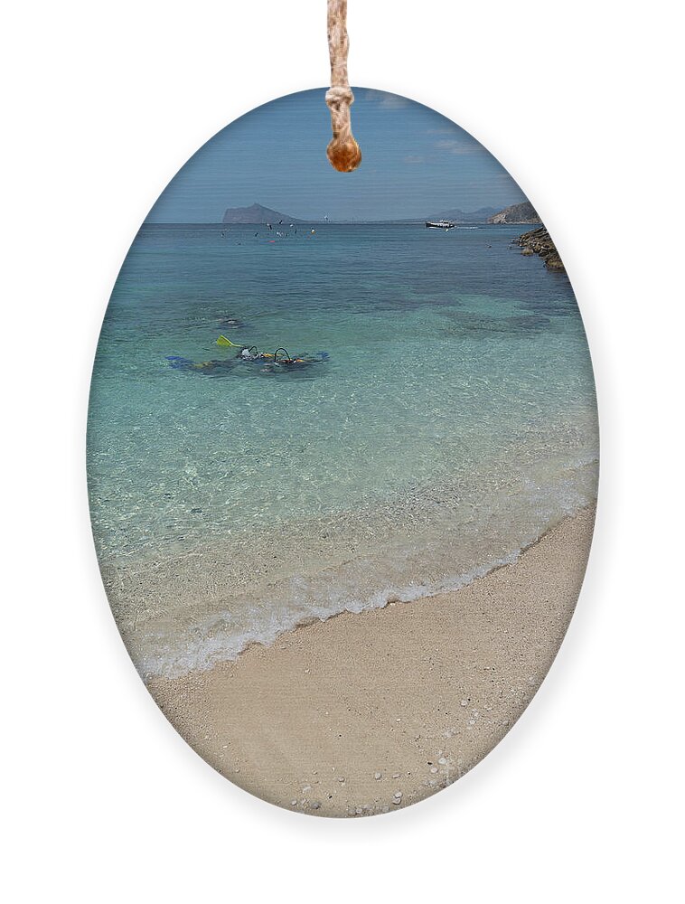 Mediterranean Ornament featuring the photograph Turquoise blue sea water and diving in Calpe by Adriana Mueller