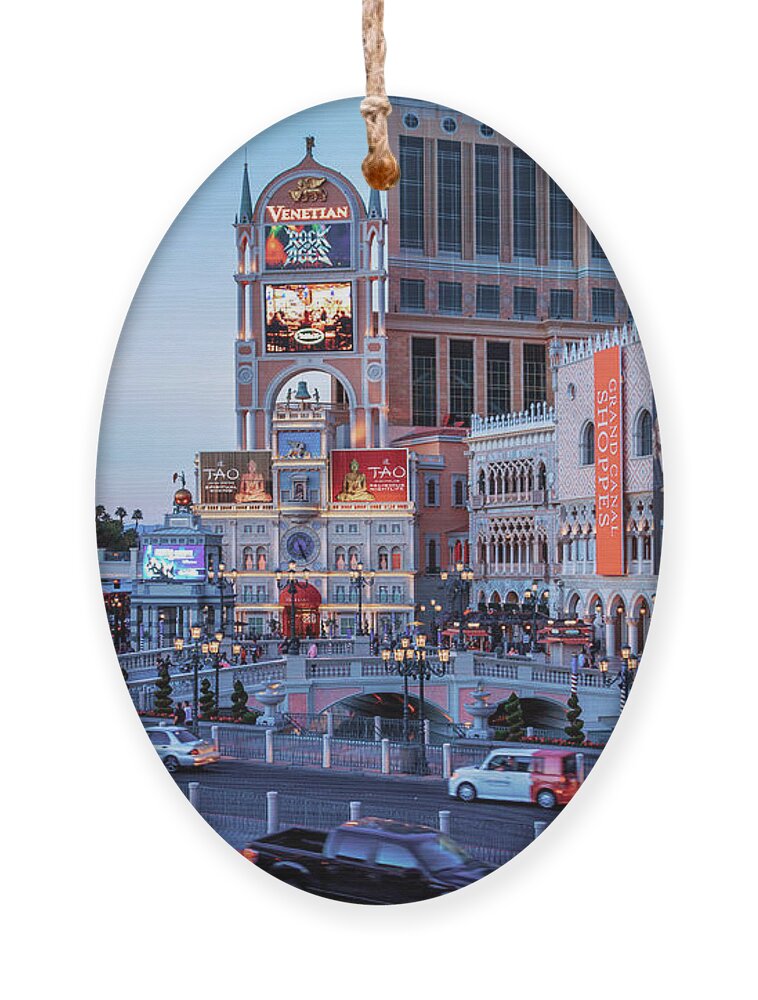 The Venetian Las Vegas Ornament featuring the photograph Venetian on Las Vegas Strip at dusk by Tatiana Travelways