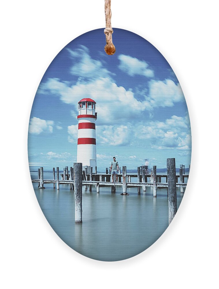 Destinations Ornament featuring the photograph White-red lighthouse in Podersdorf am See by Vaclav Sonnek