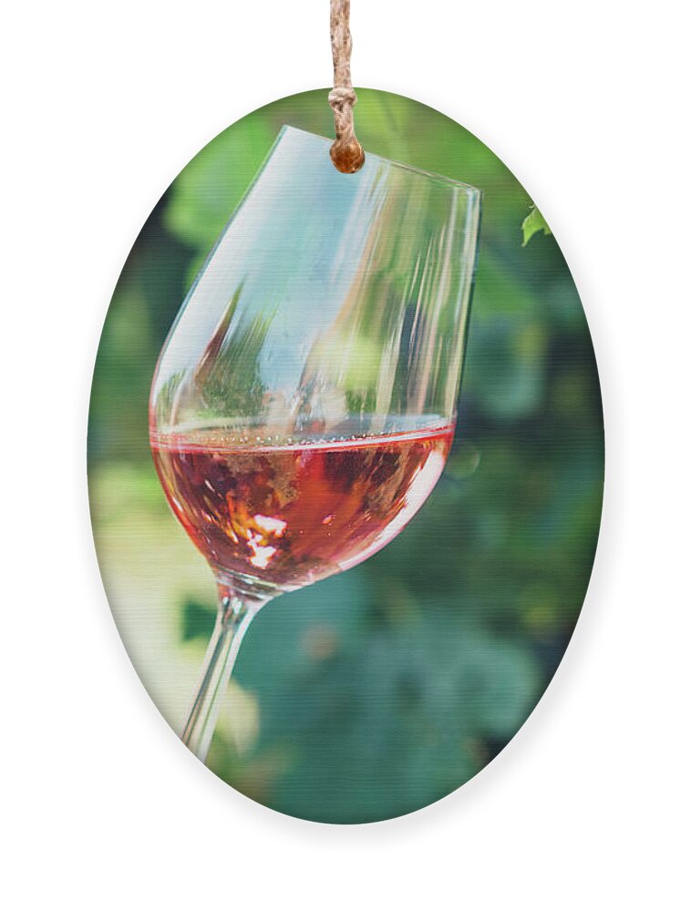 Wine Ornament featuring the photograph Wine tasting in outdoor winery. by Jelena Jovanovic