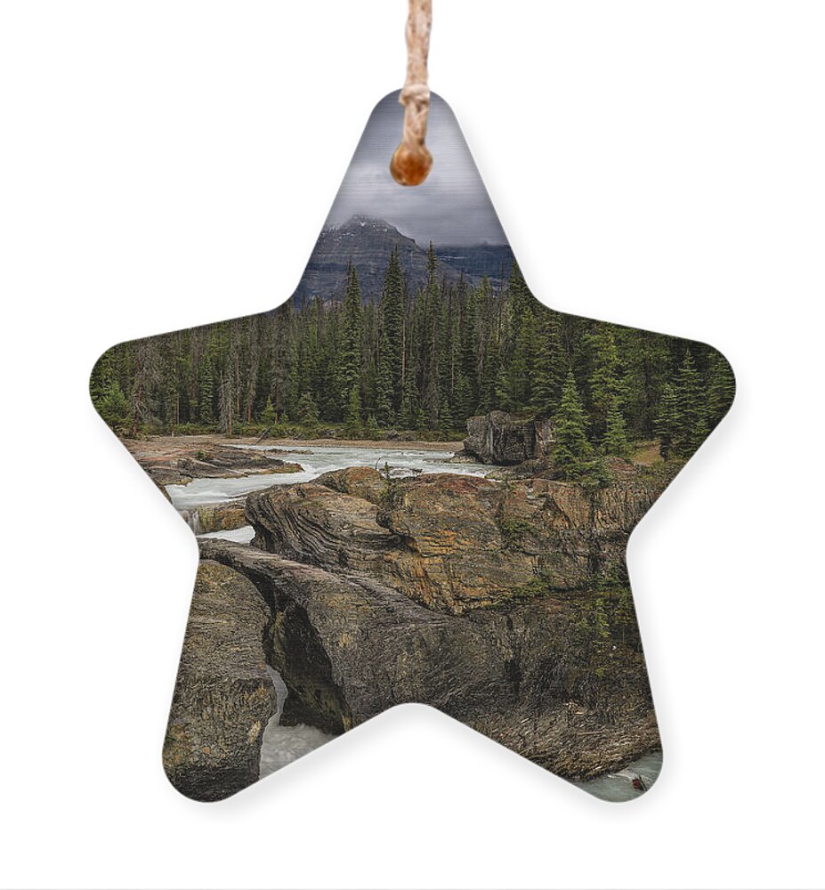 Kicking Horse River Ornament featuring the photograph Yoho Natural Bridge by Dan Sproul