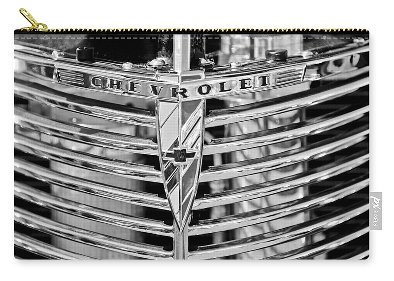 1939 Chevrolet Coupe Grille Emblem Zip Pouch featuring the photograph 1939 Chevrolet Coupe Grille Emblem by Jill Reger