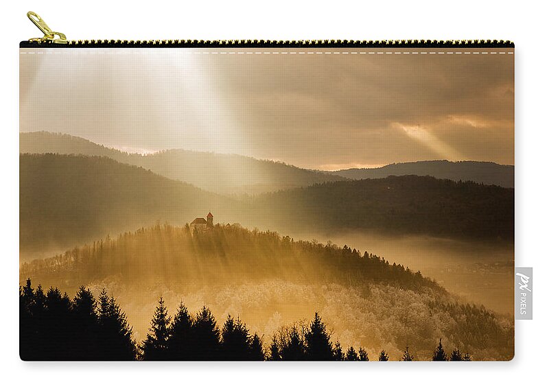Barje Zip Pouch featuring the photograph Afternoon rays over church #1 by Ian Middleton