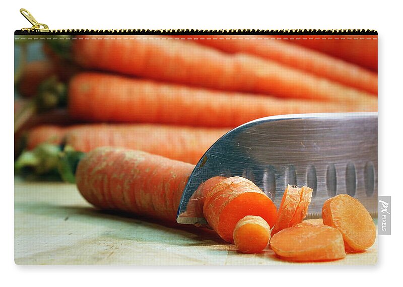 Skompski Zip Pouch featuring the photograph Carrots #1 by Joseph Skompski