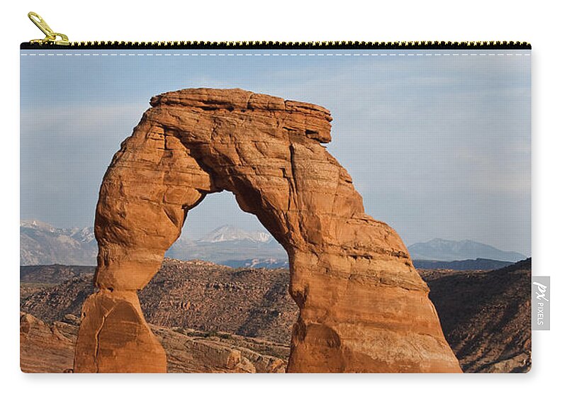 Arch Zip Pouch featuring the photograph Delicate Arch at Sunset #1 by Jeff Goulden