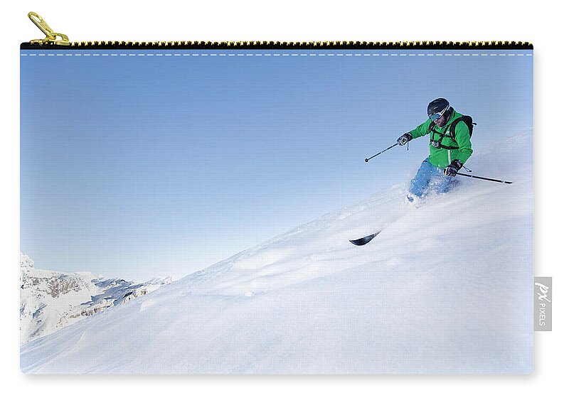 Ski Pole Zip Pouch featuring the photograph Off-piste Skier In Powder Snow #1 by Geir Pettersen