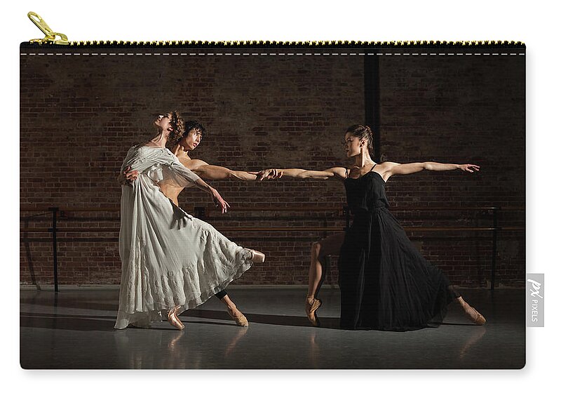 Young Men Zip Pouch featuring the photograph Three Ballet Dancers Performing Together #1 by Nisian Hughes