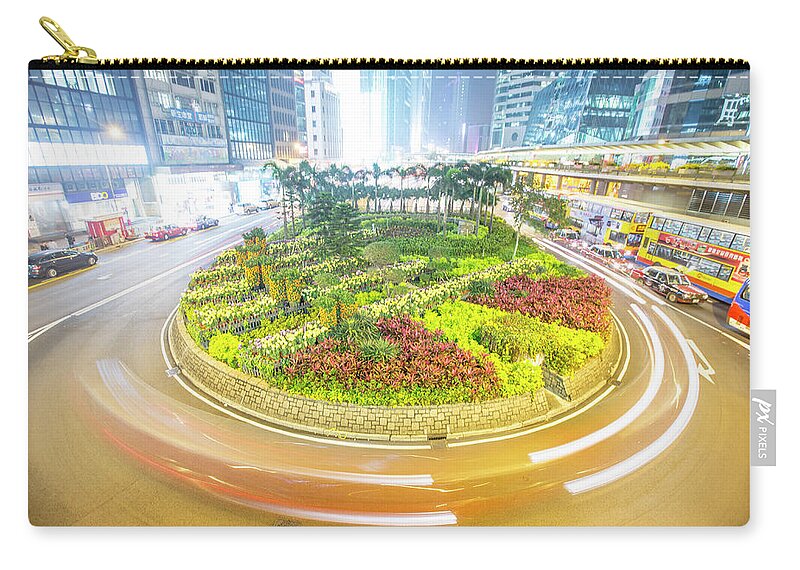 Outdoors Zip Pouch featuring the photograph Traffic Around A Planted Roundabout In #1 by James Morgan