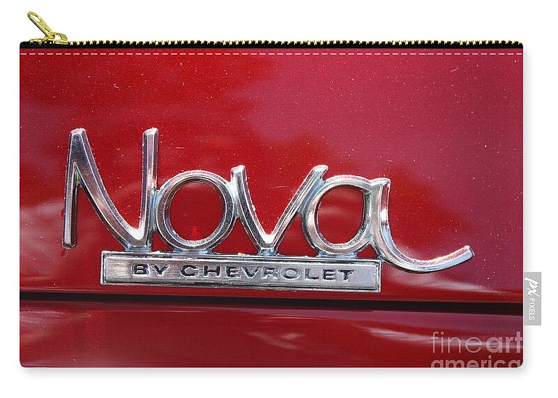 1970 Chevy Nova Logo Zip Pouch featuring the photograph 1970 Chevy Nova Logo by John Telfer