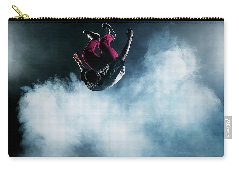 Copenhagen Zip Pouch featuring the photograph Dancer Leaping Through Smoke #2 by Henrik Sorensen