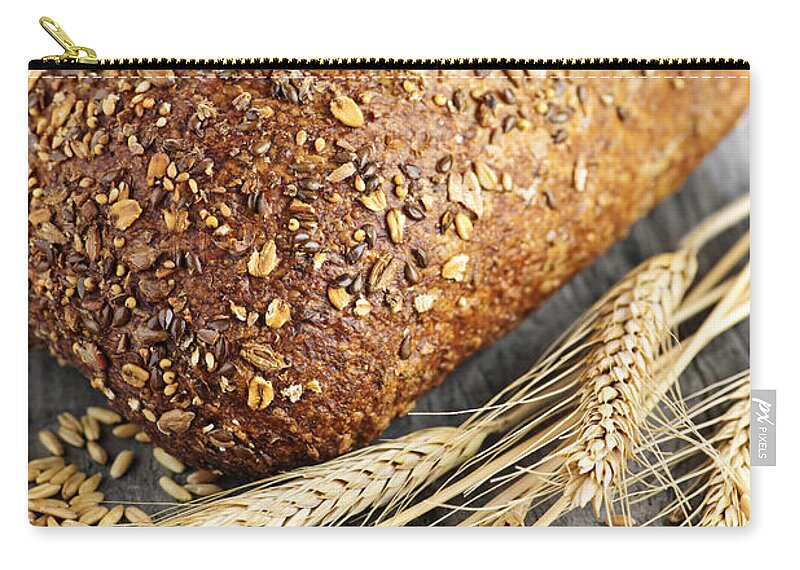 Bread Carry-all Pouch featuring the photograph Loaf of multigrain bread 2 by Elena Elisseeva