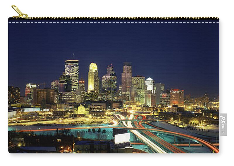 Photography Zip Pouch featuring the photograph Buildings Lit Up At Night In A City #4 by Panoramic Images
