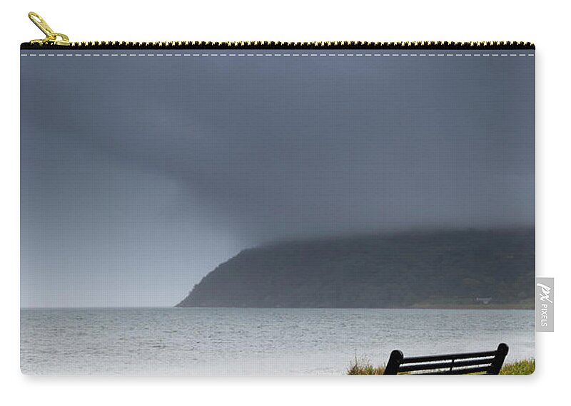 Grass Zip Pouch featuring the photograph A Bench At The Waters Edge With A Dark by John Short / Design Pics