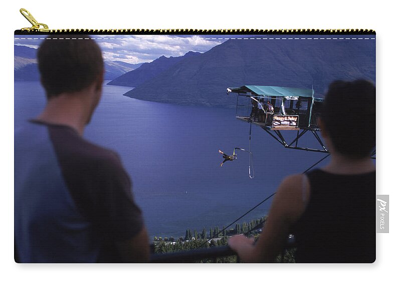Adrenaline Zip Pouch featuring the photograph A Bungee Jumper Takes The Plunge by David McLain