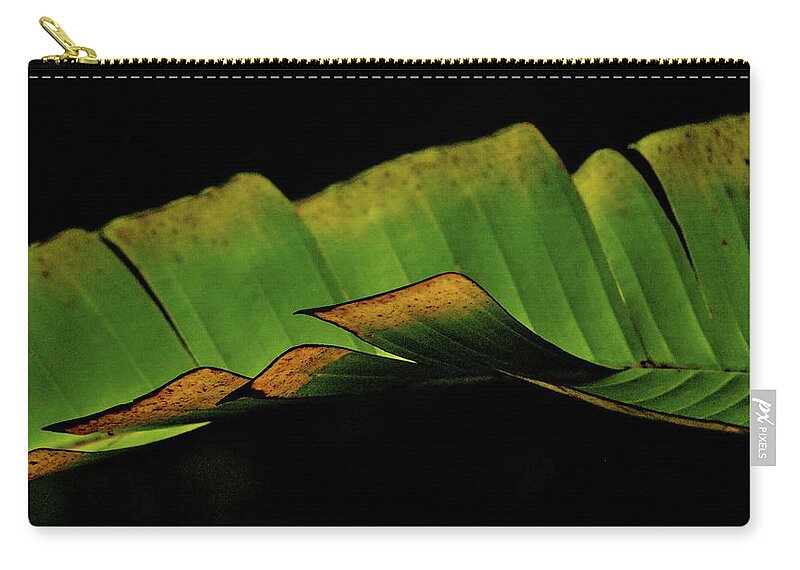 Green Zip Pouch featuring the photograph A floating Heliconia Leaf by Lehua Pekelo-Stearns