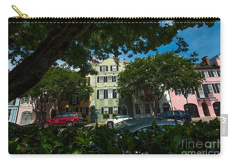 Rainbow Row Zip Pouch featuring the photograph A Peek Through the Tree's by Dale Powell