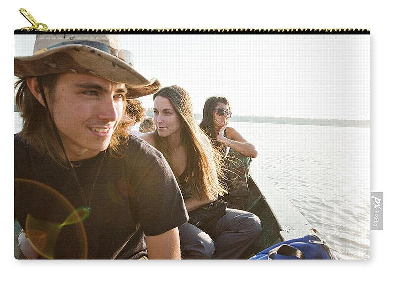 20-24 Years Zip Pouch featuring the photograph A Young Man And Two Young Women Gaze by R. Tyler Gross