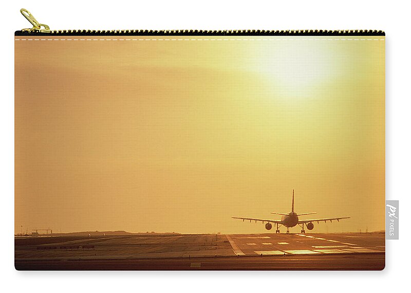 Photography Zip Pouch featuring the photograph Airplane On Runway by Panoramic Images