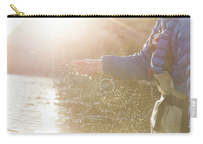 Angler Fishing With His Orvis Fly Reel Zip Pouch by Wray Sinclair