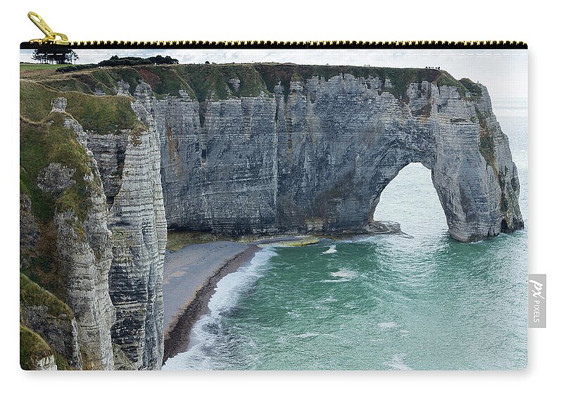 Water's Edge Zip Pouch featuring the photograph Arch And Cliff Along The Coast by Chrisvankan