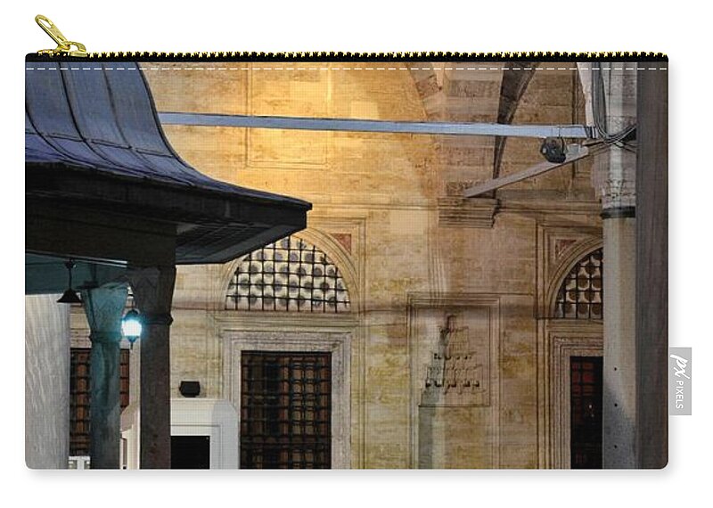  Mosque Zip Pouch featuring the photograph Back lit interior of mosque by Imran Ahmed