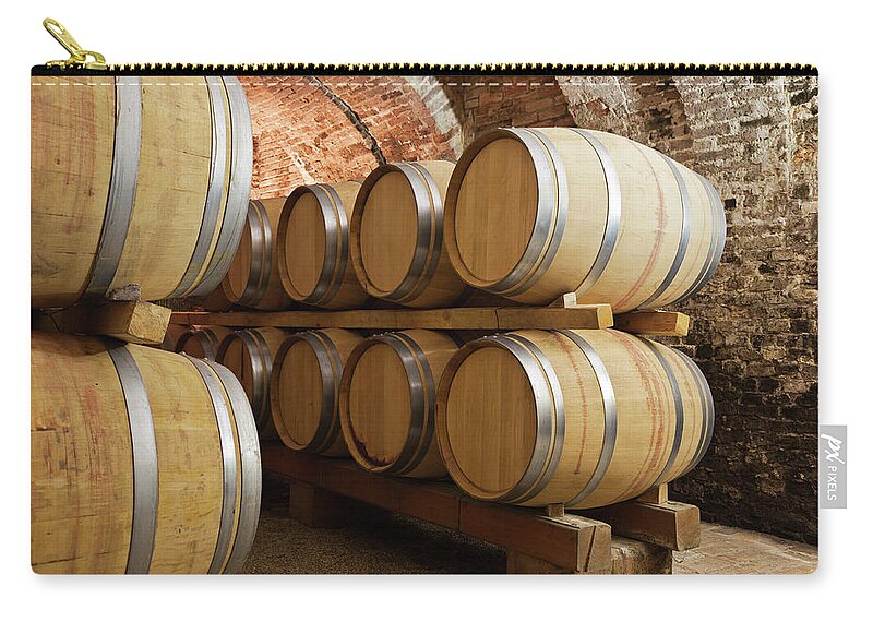 Fermenting Zip Pouch featuring the photograph Barrels In Wine Cellar by Stockwerk