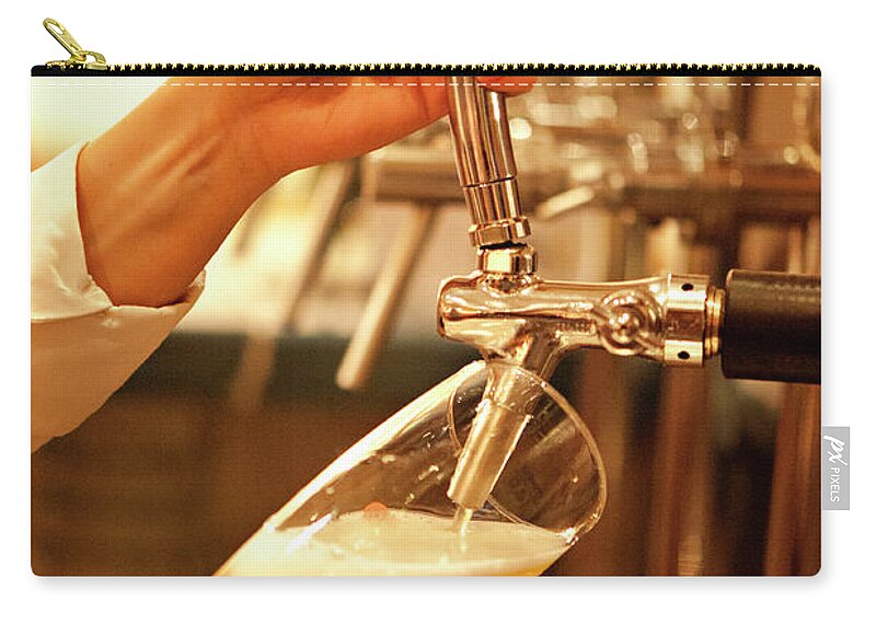 People Zip Pouch featuring the photograph Bartender Tapping Beer In Bar by Ralucahphotography.ro