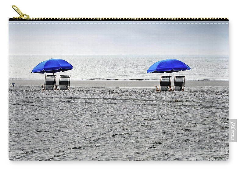 Hilton Head Zip Pouch featuring the photograph Beach Umbrellas on a Cloudy Day by Thomas Marchessault