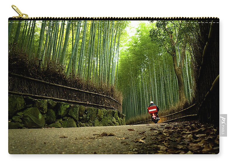Crash Helmet Zip Pouch featuring the photograph Bike Running Through Bamboo Grove by Marser