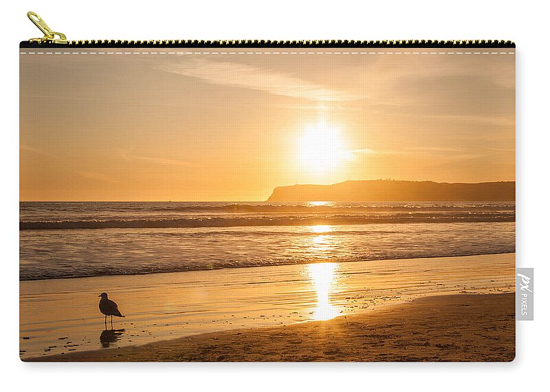 America Zip Pouch featuring the photograph Bird and his sunset by John Wadleigh
