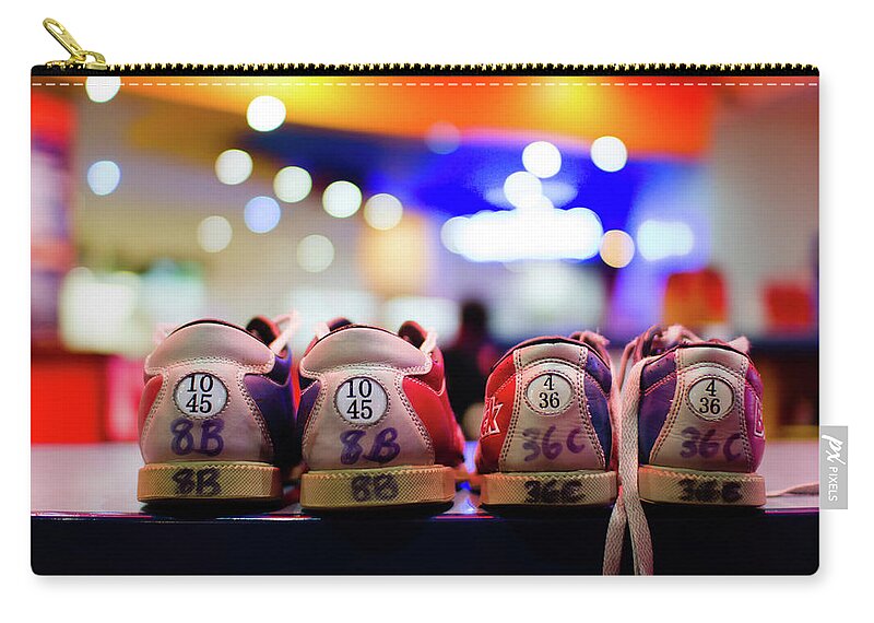 In A Row Zip Pouch featuring the photograph Bokehshoes by Alexturton