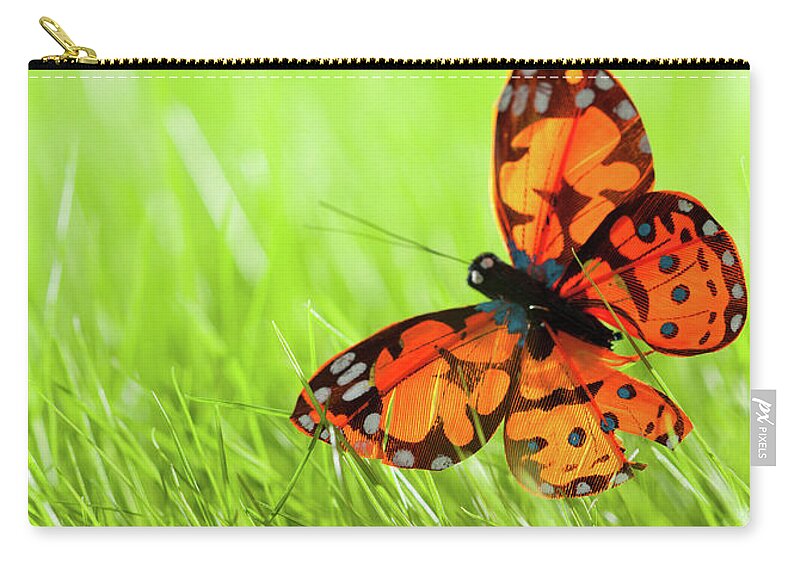 Grass Zip Pouch featuring the photograph Butterfly by Nadyaphoto