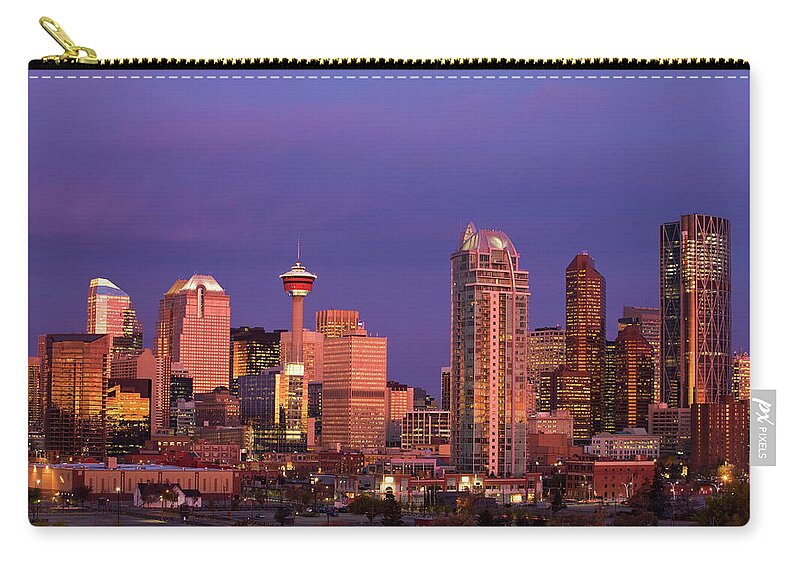Dawn Zip Pouch featuring the photograph Calgary Skyline At Dawn With City by Michael Interisano / Design Pics