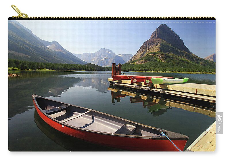 Scenics Zip Pouch featuring the photograph Canoe At St Mary Lake In Glacier by L. Toshio Kishiyama