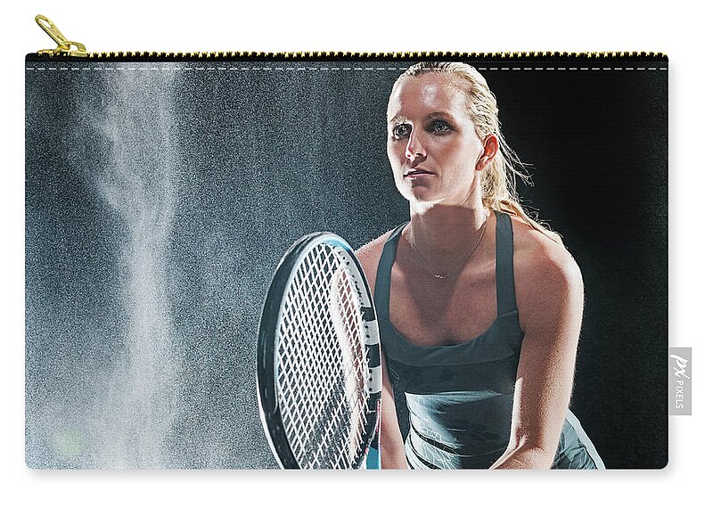Tennis Zip Pouch featuring the photograph Caucasian Tennis Player Standing In Rain by Erik Isakson