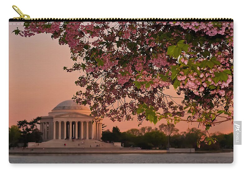 America Zip Pouch featuring the photograph Cherry Blossoms Framing the Jefferson Memorial at Sunset by Mitchell R Grosky