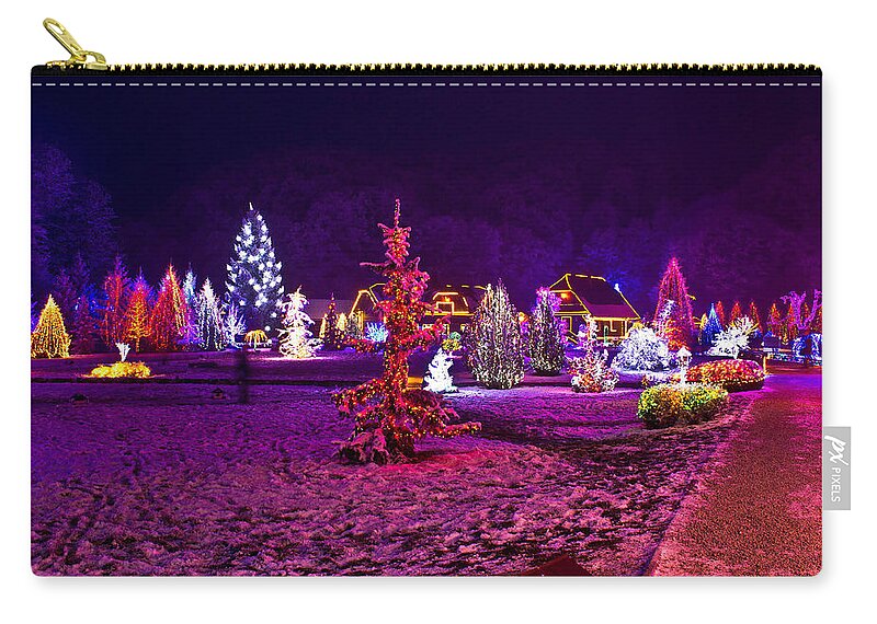 Christmas Zip Pouch featuring the mixed media Christmas lights in town park - fantasy colors by Brch Photography