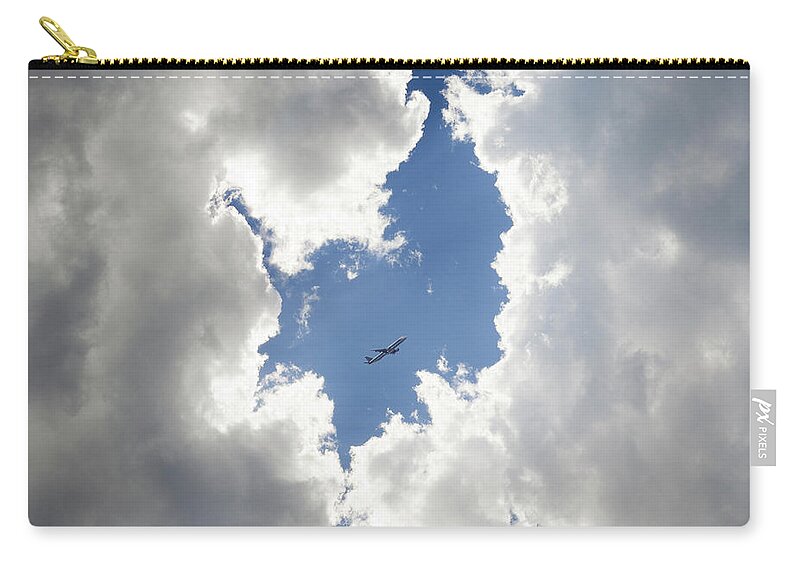 Airplane Zip Pouch featuring the photograph Circle Of Clouds With Airplane by Rinocdz