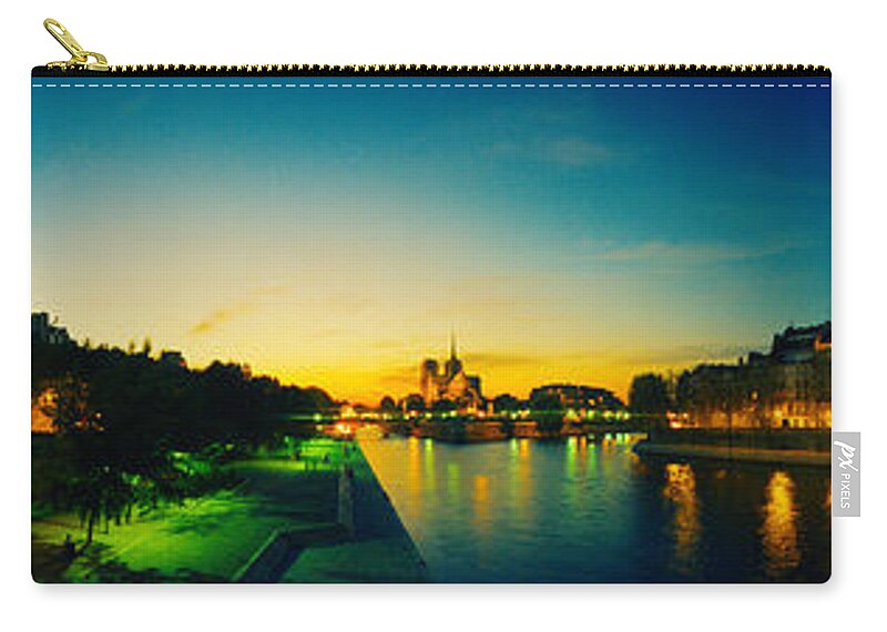 Photography Zip Pouch featuring the photograph City Lit Up At Dusk, Notre Dame, Paris by Panoramic Images