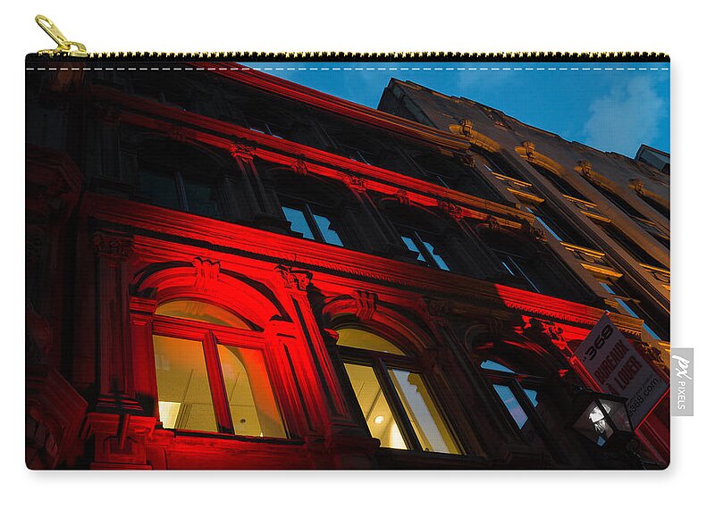 Red Facade Zip Pouch featuring the photograph City Night Walks - Bright Red Facade by Georgia Mizuleva