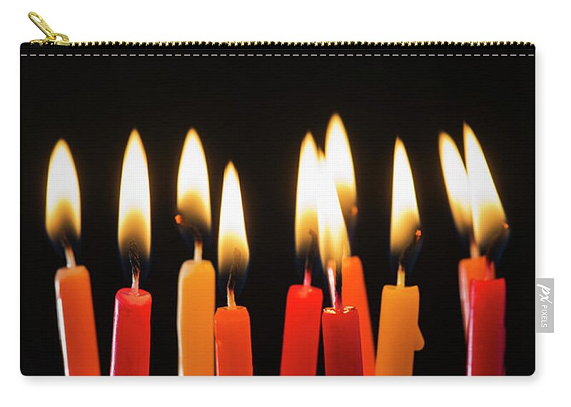 Black Background Zip Pouch featuring the photograph Close-up Of Birthday Candles by Daniel Grill