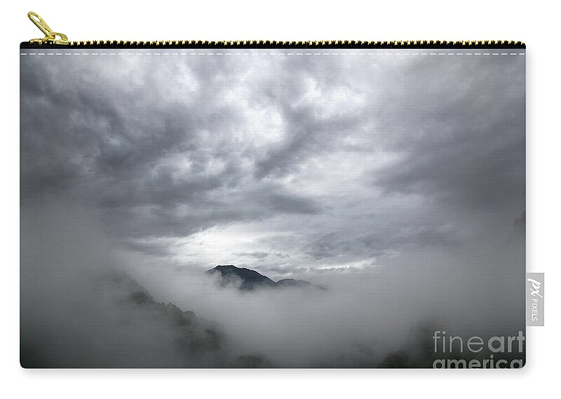 Mountain Zip Pouch featuring the photograph Clouds and mountain by Mats Silvan