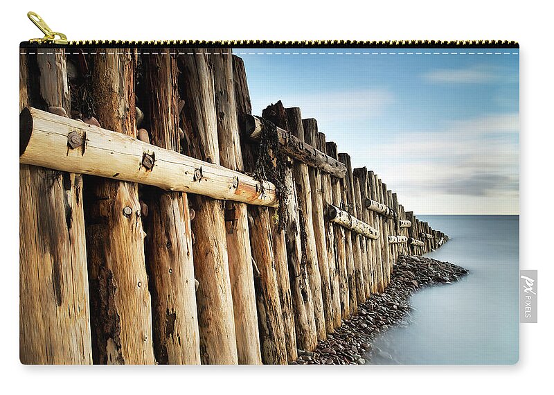 Wooden Post Zip Pouch featuring the photograph Coast by Jeremy Walker