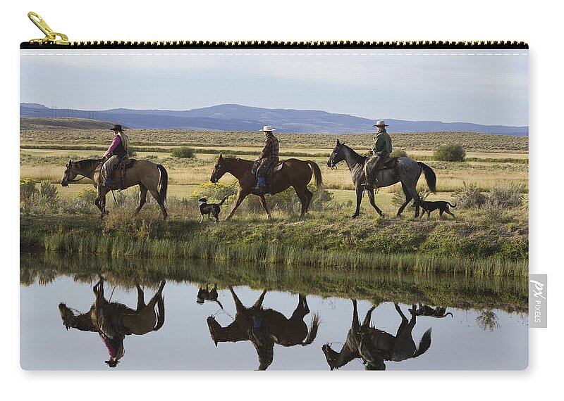 Feb0514 Zip Pouch featuring the photograph Cowboys And A Cowgirl Riding Oregon by Konrad Wothe