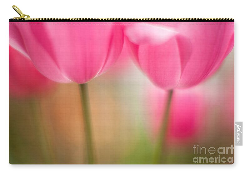 Tulip Zip Pouch featuring the photograph Delicate Light of Spring by Mike Reid