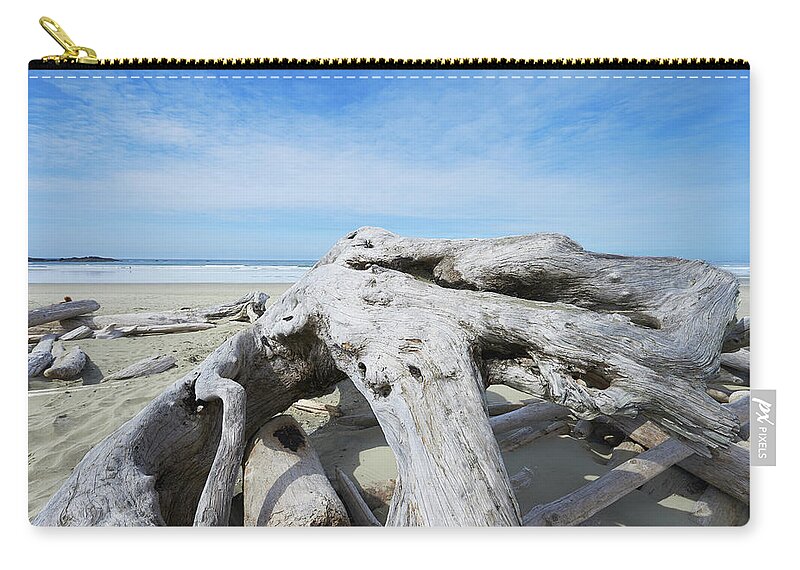 Vancouver Island Zip Pouch featuring the photograph Driftwood On Wickininish Beach by Ian Crysler / Design Pics